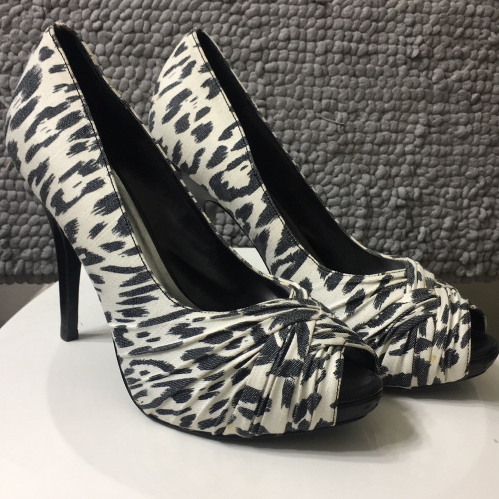 Black and White, peep toe cheetah print pumps.